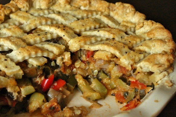 cross section of a sliced ratatouille pie full of summer vegetables