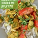 stir-fired Burmese chicken kebat on a square plate with a lemon wedge on the side