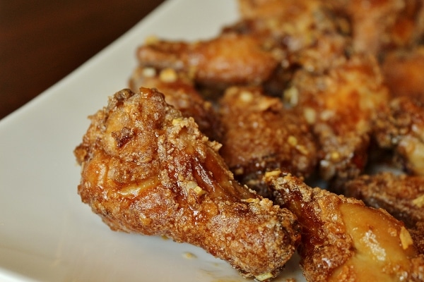 Closeup of fried Saigon chicken wings on a white plate