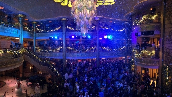 fake snow falling inside the Disney Fantasy\'s lobby atrium