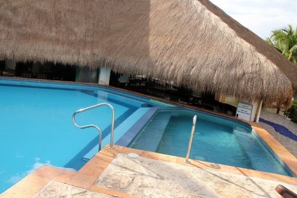 a hot tub next to a pool