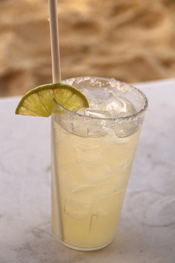 a closeup of a margarita on the beach