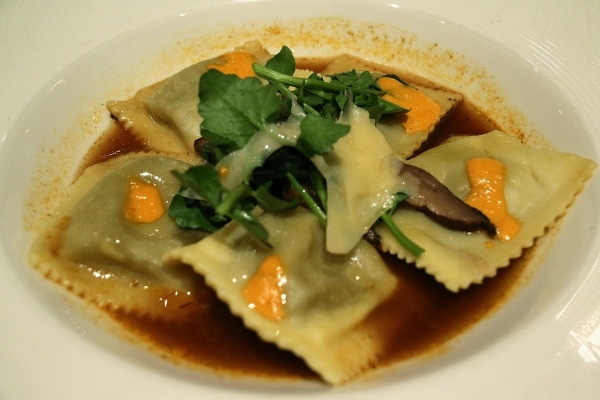 ravioli served in a rich brown broth