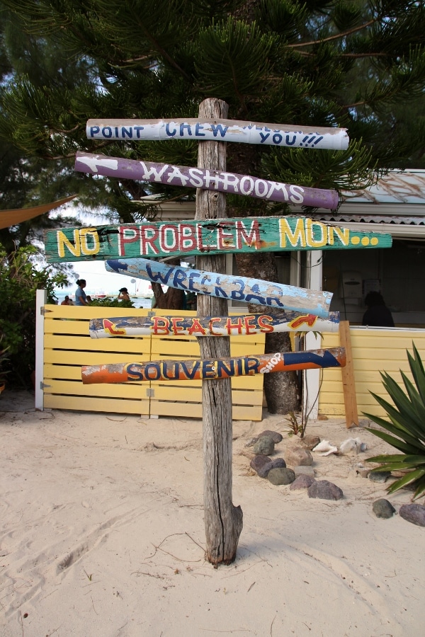 more wooden signs on a beach