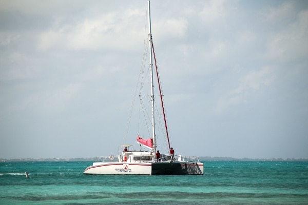 a catamaran in the water in the distance