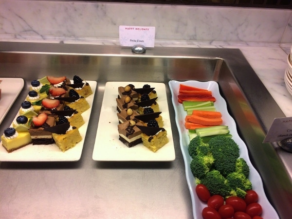 desserts and raw vegetables on a buffet