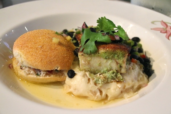 side view of a plate of fish served with an arepa