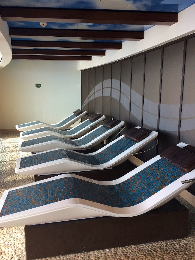 a row of tiled lounge chairs