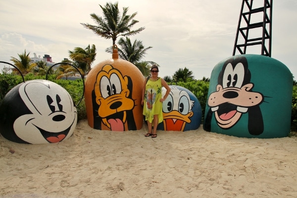 a woman posing at Mount Rustmore on Disney\'s Castaway Cay