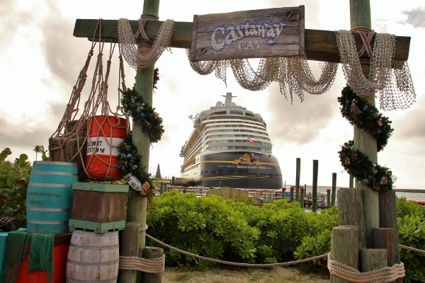 view of the Disney Fantasy cruise ship through Castaway Cay sign