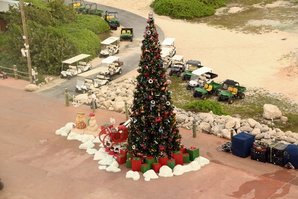 wide view of the Christmas tree on Castaway Cay with golf carts parked nearby