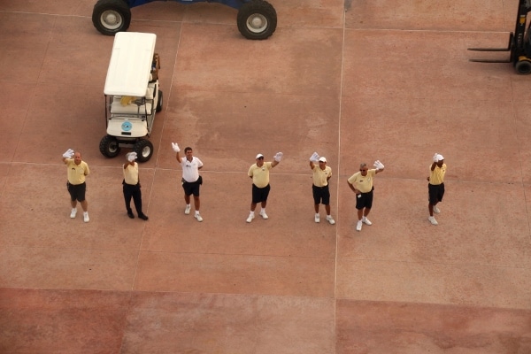 A group of people waving from a distance