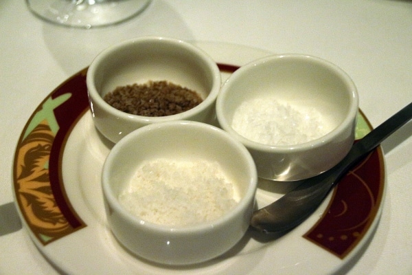 3 small dishes filled with different kinds of salt