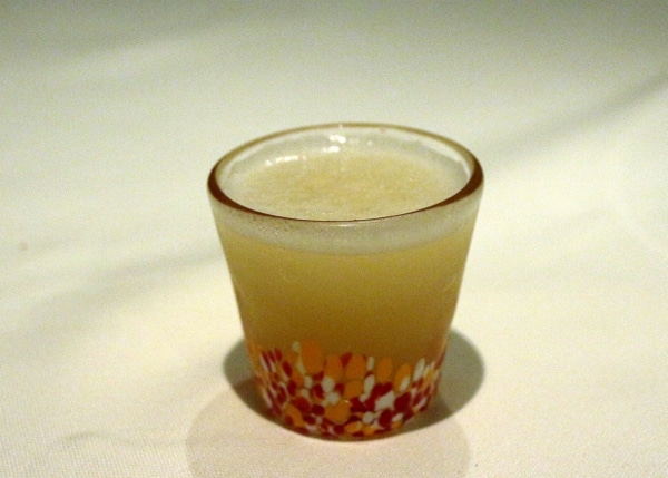 a small shot glass filled with liquid