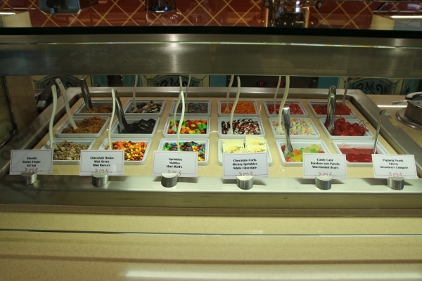 a variety of candies and toppings for ice cream