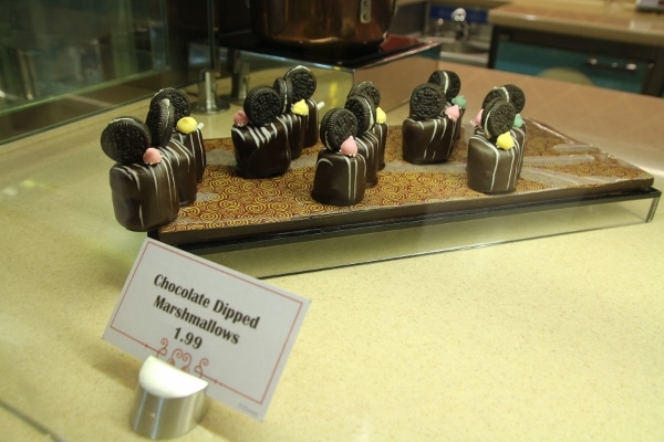 a display of chocolate dipped marshmallows