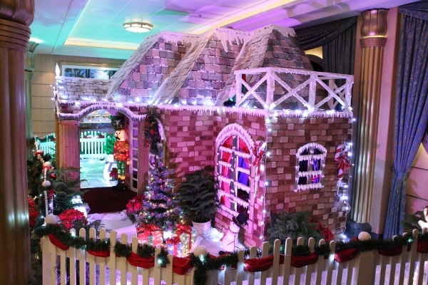 side view of a large gingerbread house on a cruise ship