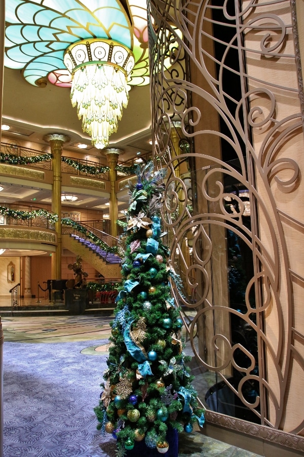 view of a small Christmas tree in the Disney Fantasy\'s lobby