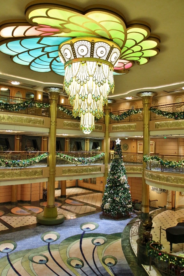 a wide view of the Disney Fantasy lobby atrium decorated for Christmas