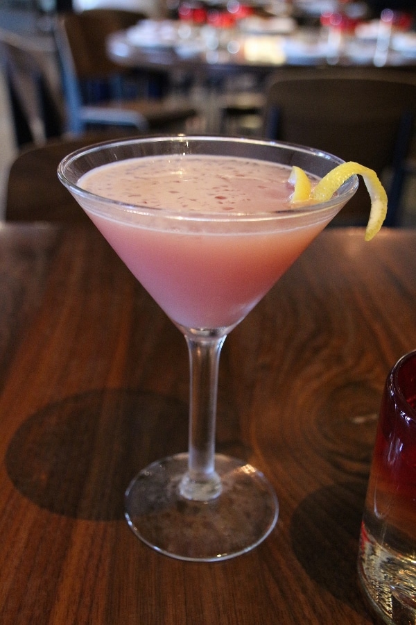 a pink cocktail in a glass