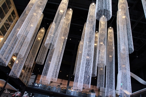 tall crystal chandeliers hanging in a restaurant