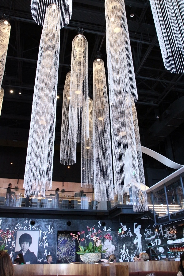 interior of Morimoto Asia with tall glass chandeliers hanging from the ceiling