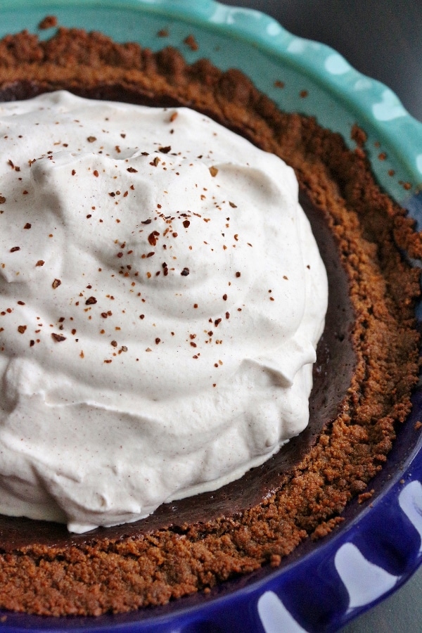 closeup of a Mexican chocolate pie in a blue pie dish