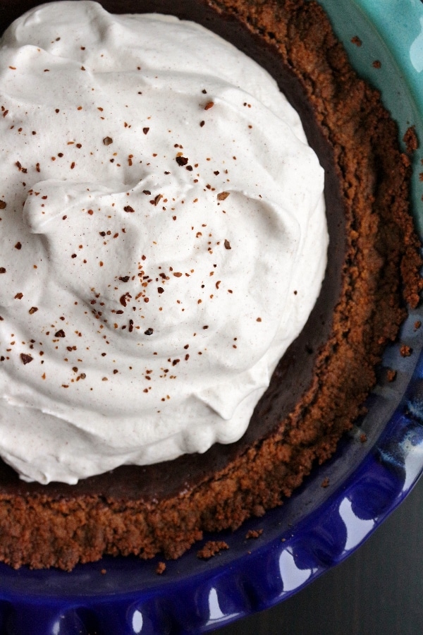 overview close up of a Mexican chocolate pie topped with whipped cream