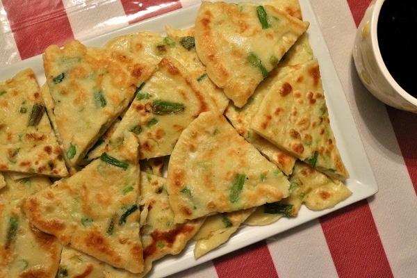 an overhead view of a plate of Korean scallion pancakes