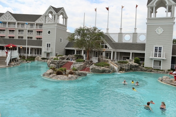 people swimming in a pool at Disney\'s Yacht and Beach Club Resorts
