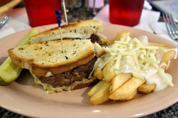 a patty melt and fries on a plate