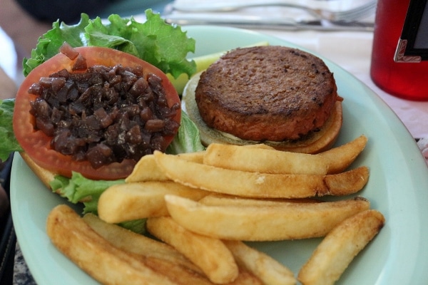a disassembled burger and fries on a plate