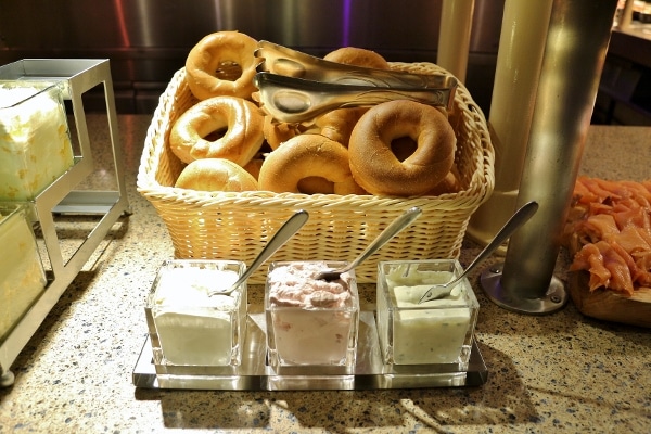 bagels with various spreads on a buffet