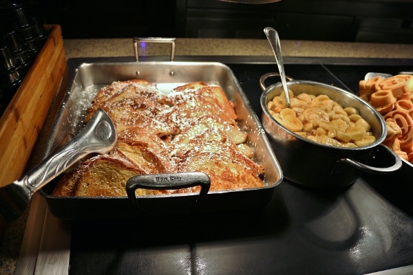 french toast with bananas on a buffet line