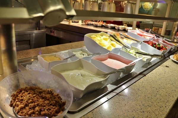 yogurts and fruits on a breakfast buffet