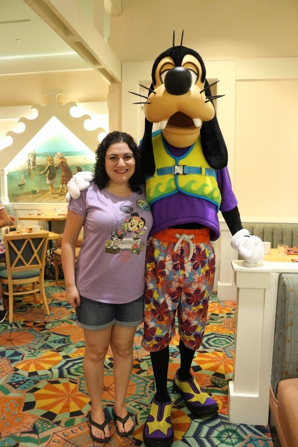 A woman posing with Goofy