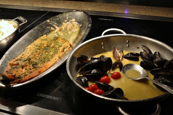 roasted salmon and steamed mussels on a buffet