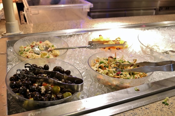 a variety of cold salads on a buffet