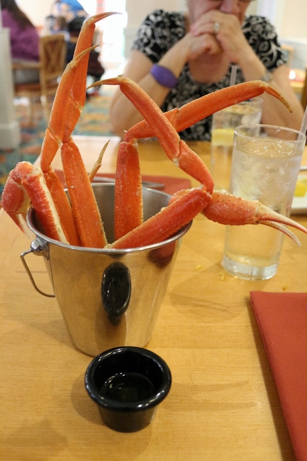 steamed crab legs in a small metal pail