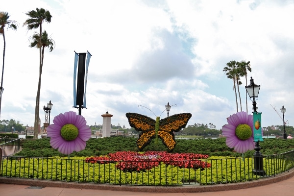 a topiary display of a butterfly and flowers