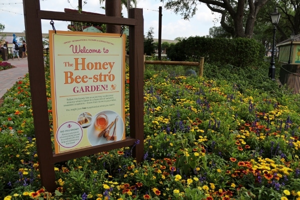 A sign that says The Honey Bee-stro Garden