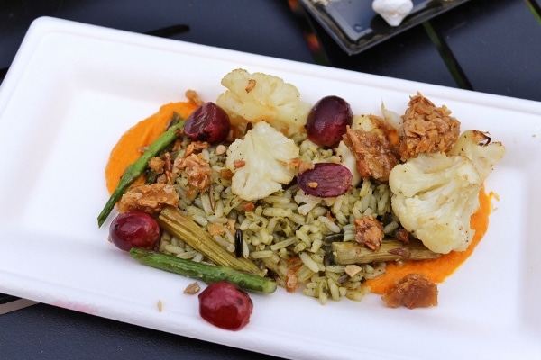 closeup of a plate of cauliflower with grapes and rice