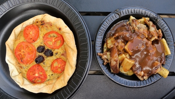 a tomato tart and a plate of Parisian gnocchi with braised duck