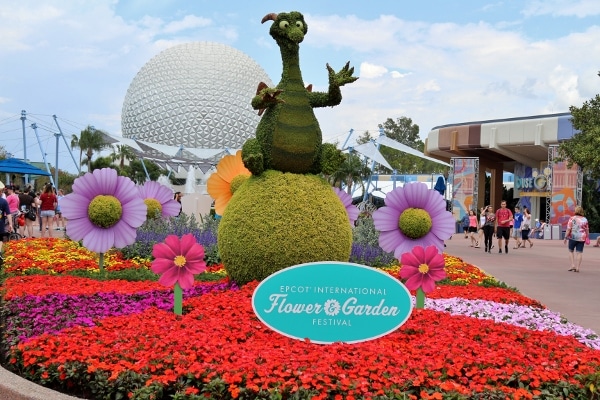 a topiary shaped like Figment at Epcot\'s Flower and Garden Festival