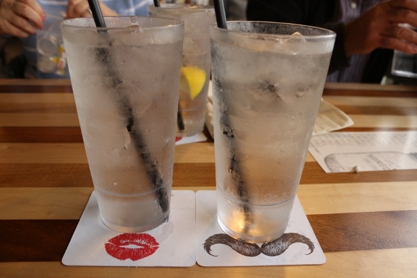 2 glasses of water on funny coasters