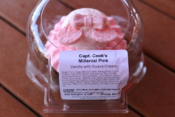 a plastic container with a cupcake inside