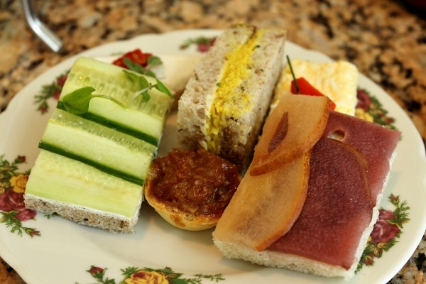 closeup of a plate of tea sandwiches