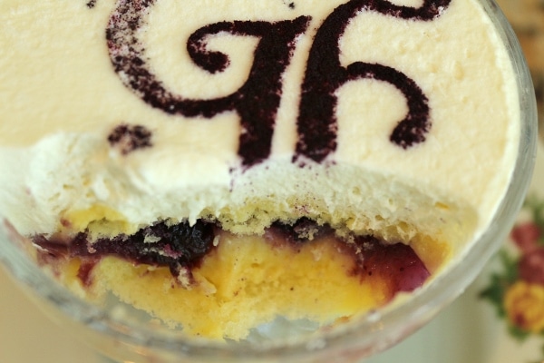 A close up of a half eaten dish of trifle