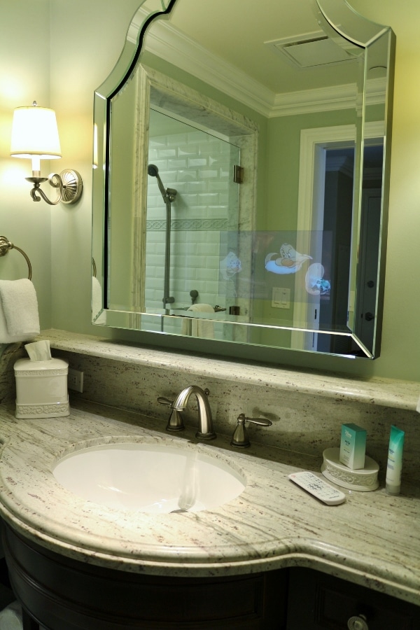 A sink and large mirror