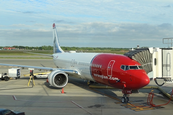 A large passenger jet sitting on top of a tarmac at an airport